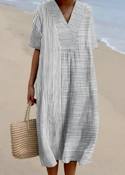 Imelda - Elegantna Geometrijska Haljina" can be rewritten as "Imelda - Stylish Geometric Dress.